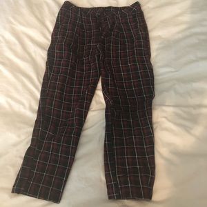 Tight fitting red, white, and black plaid pants
